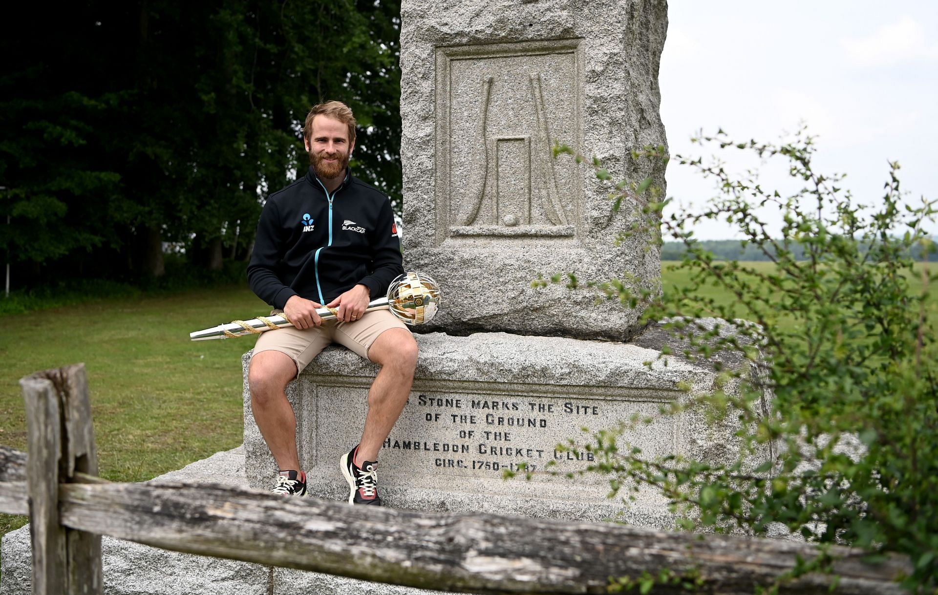 New Zealand captain Kane Williamson poses with ICC World Test Championship mace during the ICC World Test Championship Final Winners Photocall at Hambledon Cricket Club on June 24, 2021 in Hambledon, England. (Photo by Gareth Copley-ICC/ICC via Getty Images)